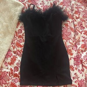 Black dress with feathers at the top
